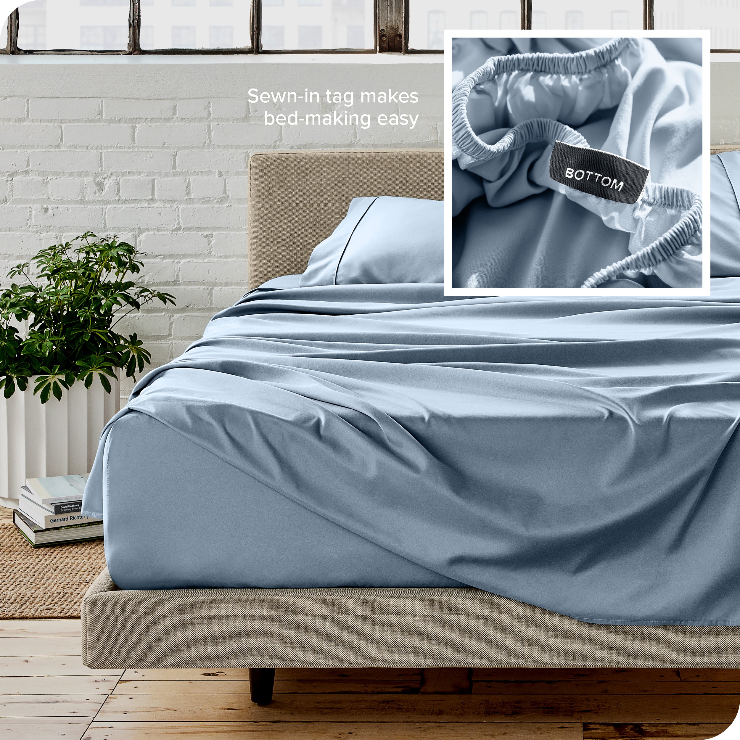 Close up of sewn in tag and matching sheets on a bed