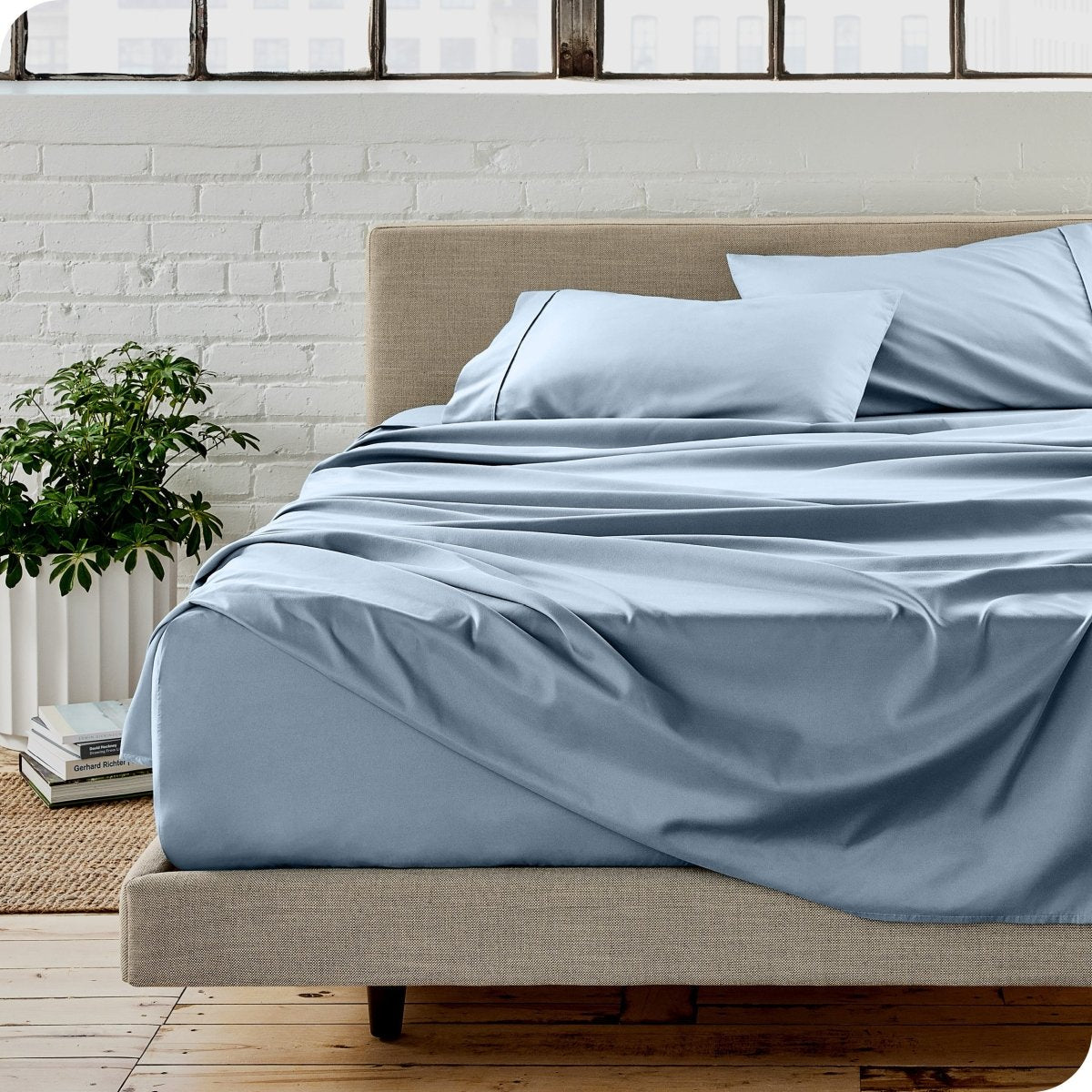 A modern bedroom with microfiber sheets on the mattress