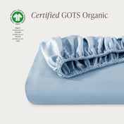 Certified GOTS Organic fitted sheet on a light gray background