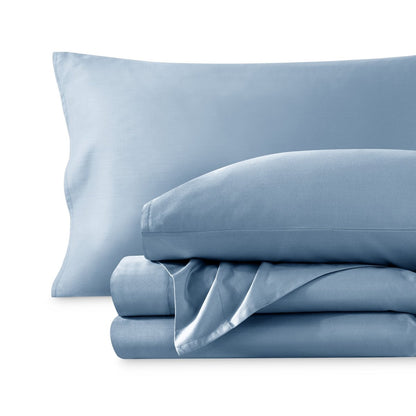 A sateen sheet set folded and stacked on a white background.