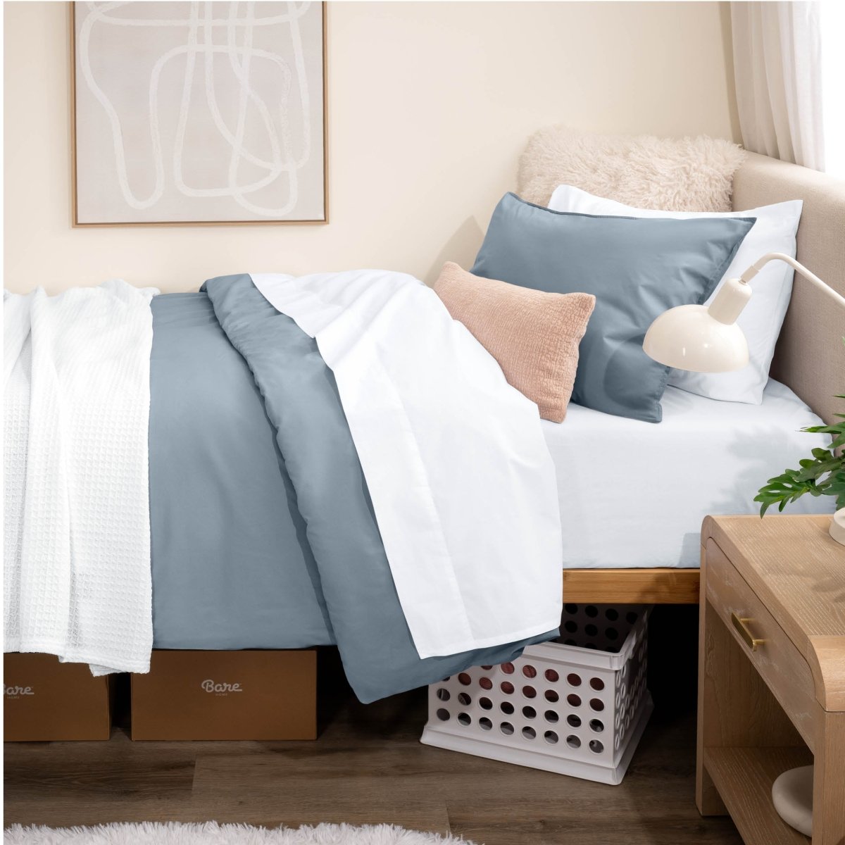 Bed with percale bedding in a dorm room setting