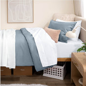 Bed with percale bedding in a dorm room setting