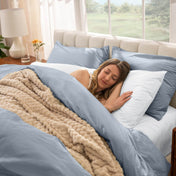 Woman sleeping in a bed with percale bedding
