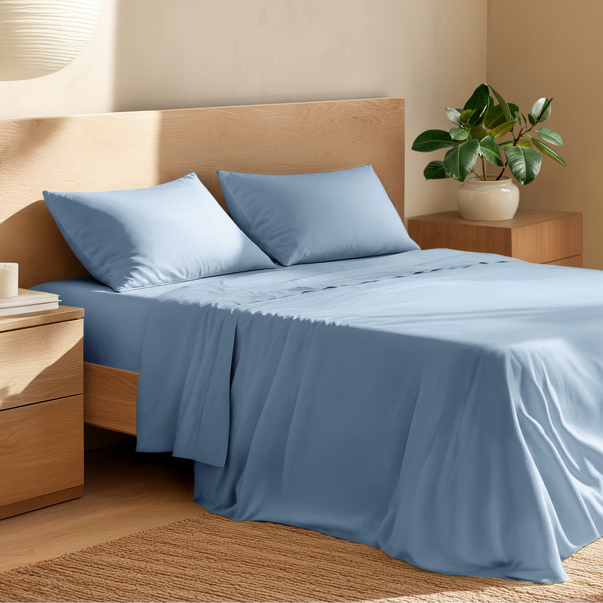 Bed with percale bedding and wooden headboard in a bedroom setting