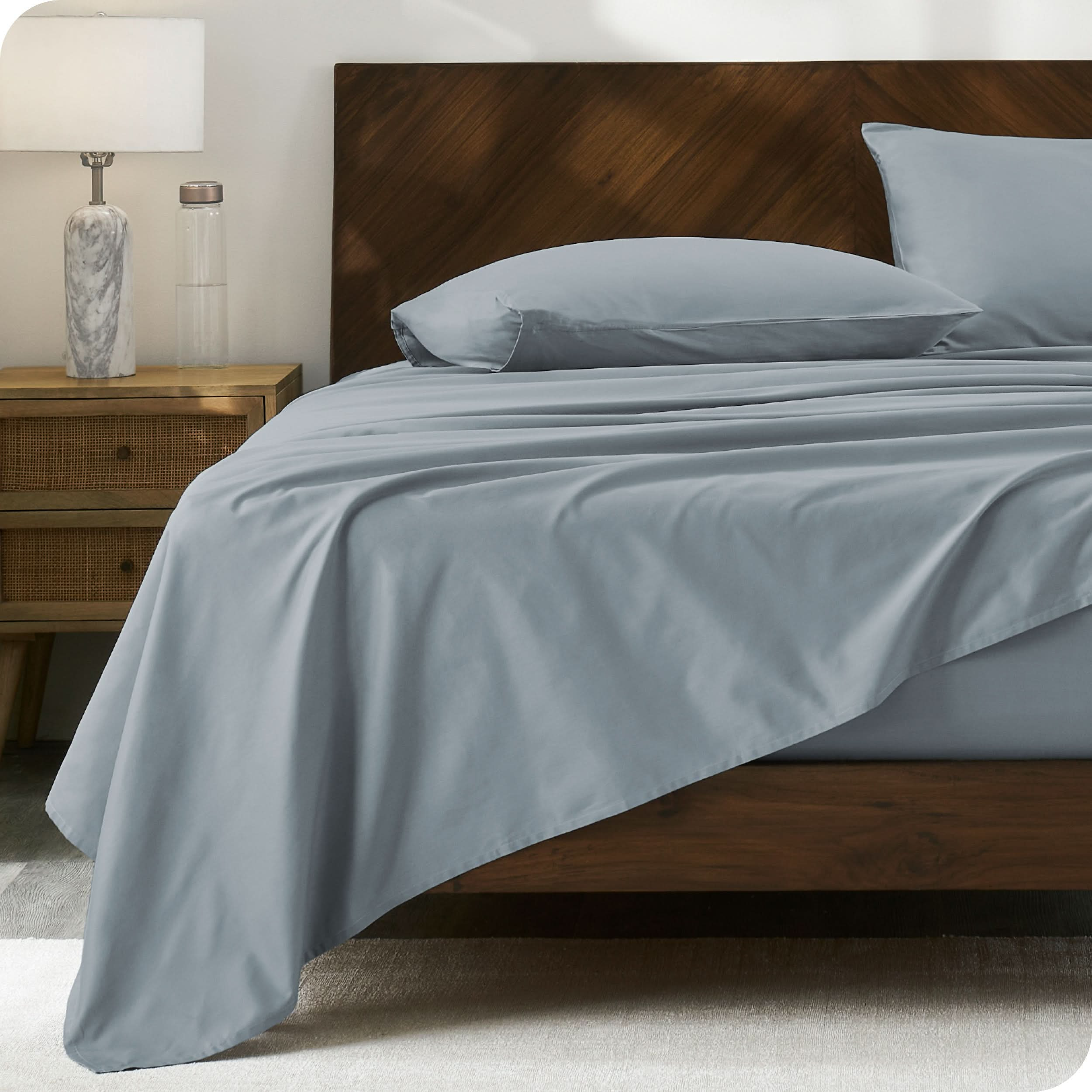 Modern wood bed made with percale sheet set