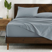 Modern wood bed made with percale sheet set