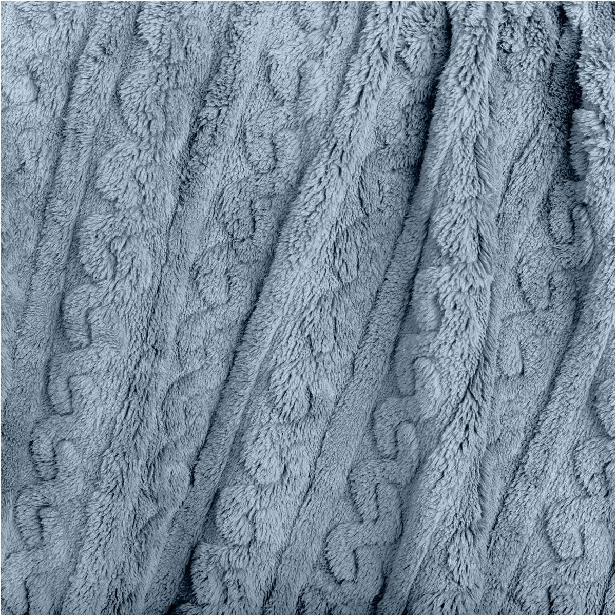 Close up of the textured cable knit blanket
