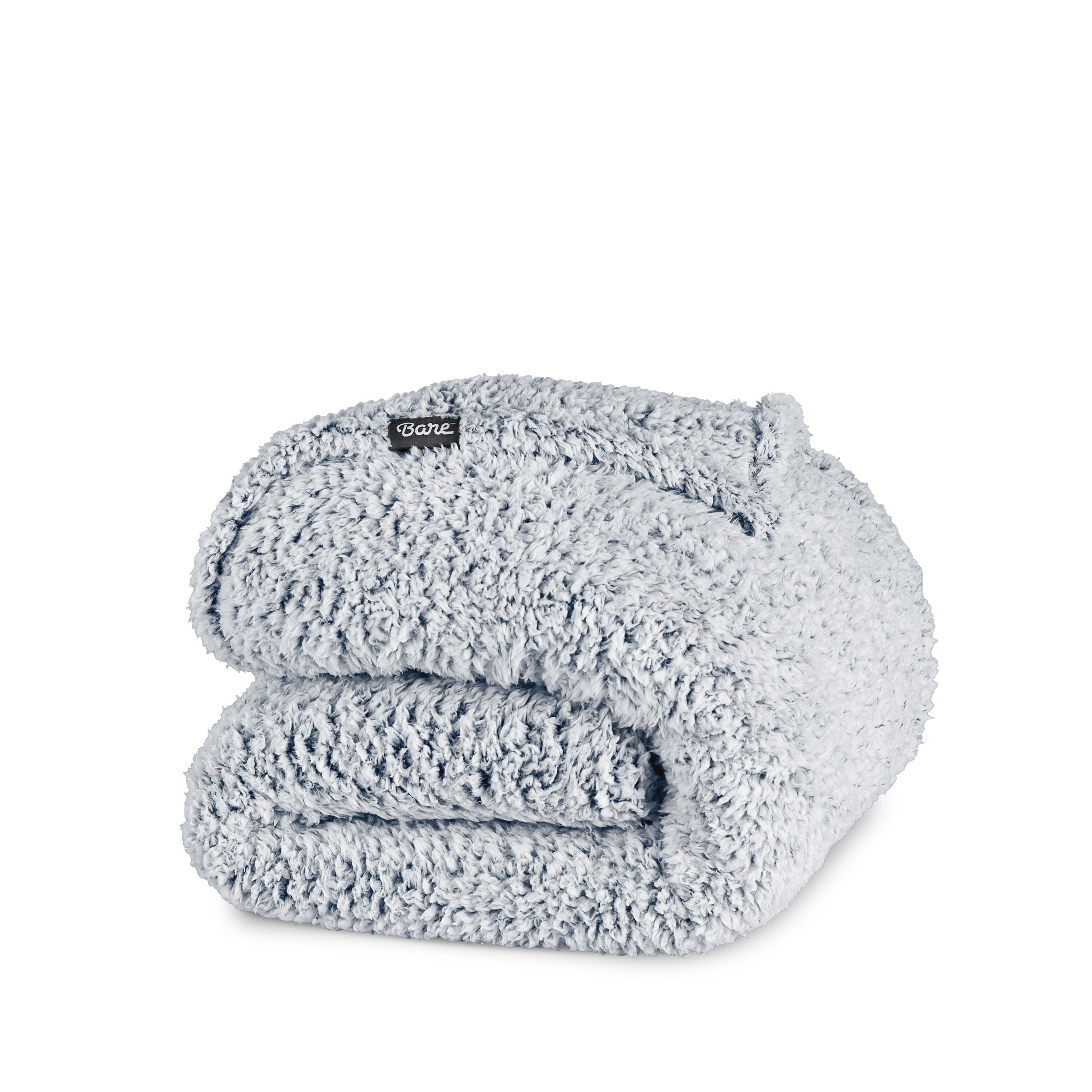 A tipped sherpa blanket folded neatly