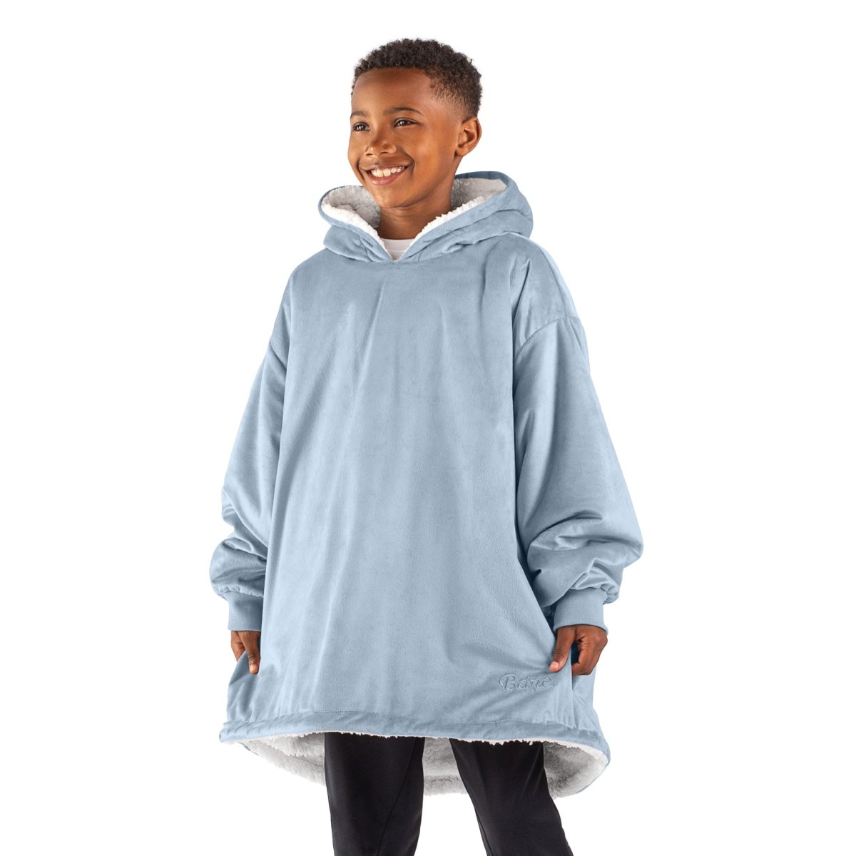 A child with a sherpa wearable blanket on