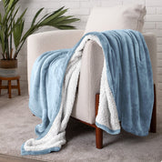 Blanket draped over a chair in a cozy living room setting.