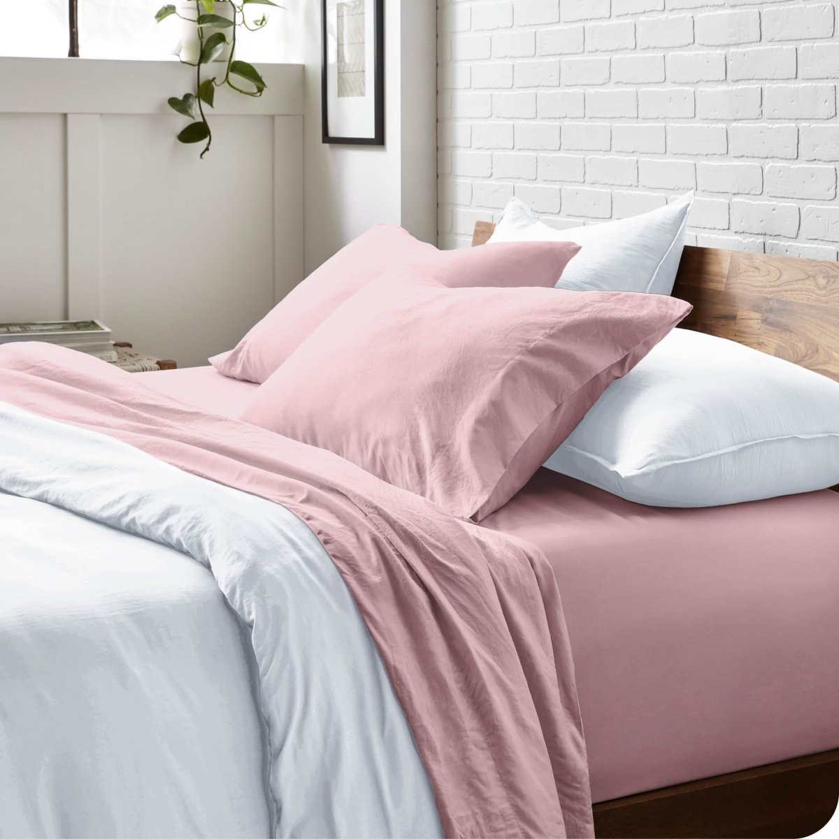 Modern bedroom with washed sheets and duvet cover on a bed