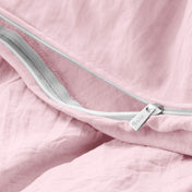 Close-up of a duvet cover with a zipper, featuring the brand Bare Home