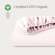 Certified GOTS Organic fitted sheet on a light gray background