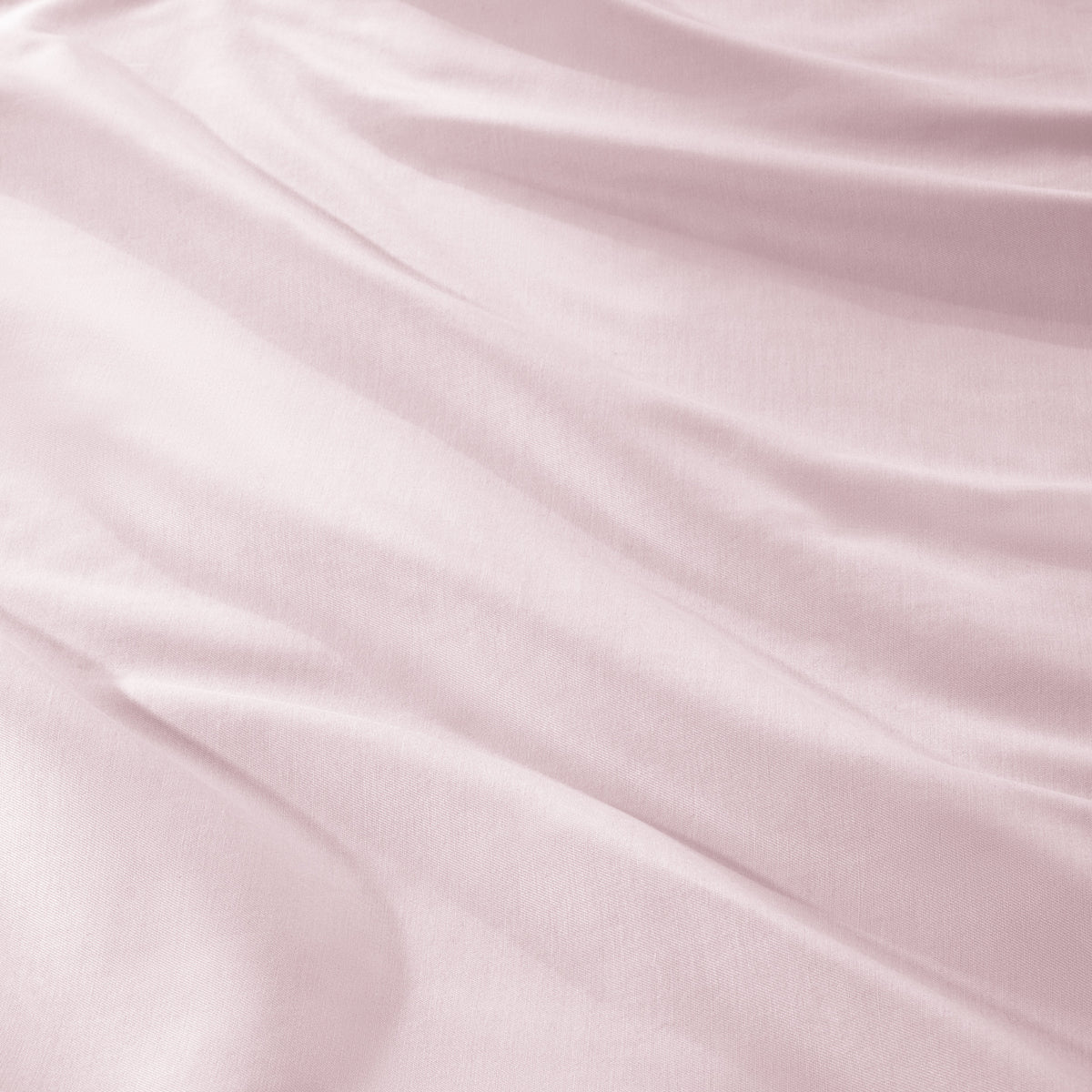A close-up of draped sateen fabric with soft folds and a smooth texture.