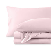 A sateen sheet set folded and stacked on a white background.
