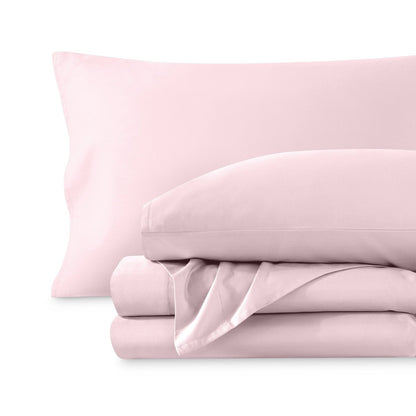 A sateen sheet set folded and stacked on a white background.