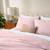 Bed with percale bedding in a bedroom setting