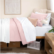Bed with percale bedding in a dorm room setting