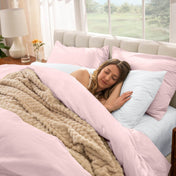 Woman sleeping in a bed with percale bedding