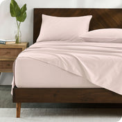 Modern wood bed made with percale sheet set