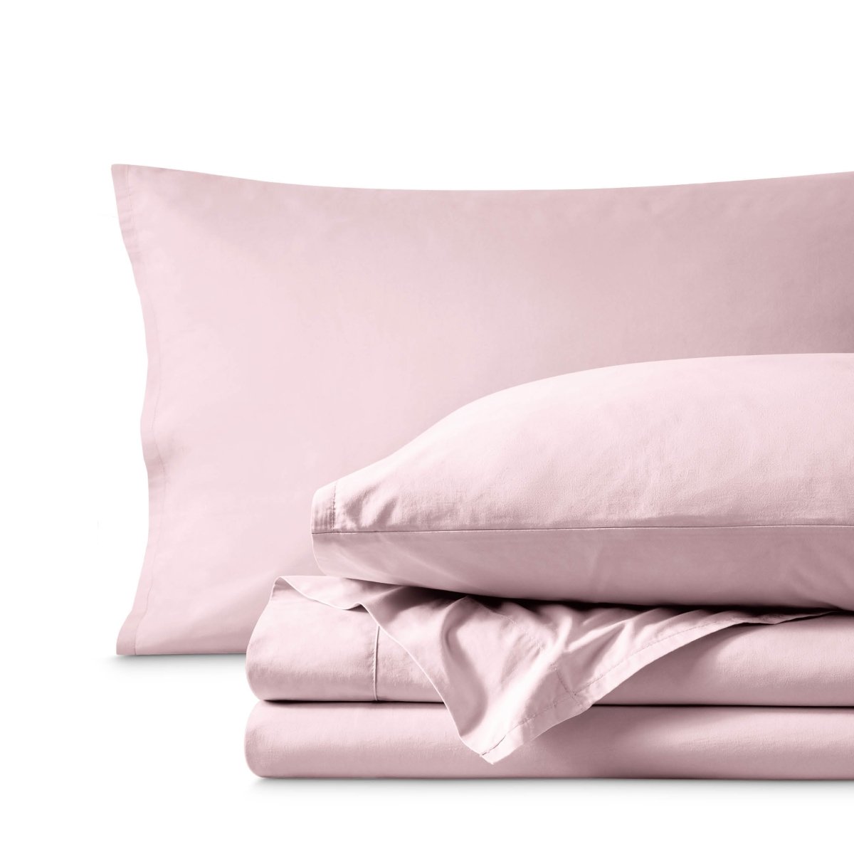 Percale bedding set including pillowcases and folded sheets arranged on a clean white background