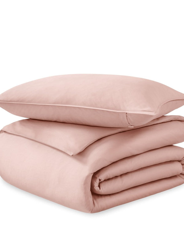 A sateen duvet set arranged in a stack