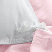 Close up of the corner ties on a duvet cover for attaching a duvet insert