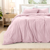Washed bedding set on a bed with a nightstand in the background