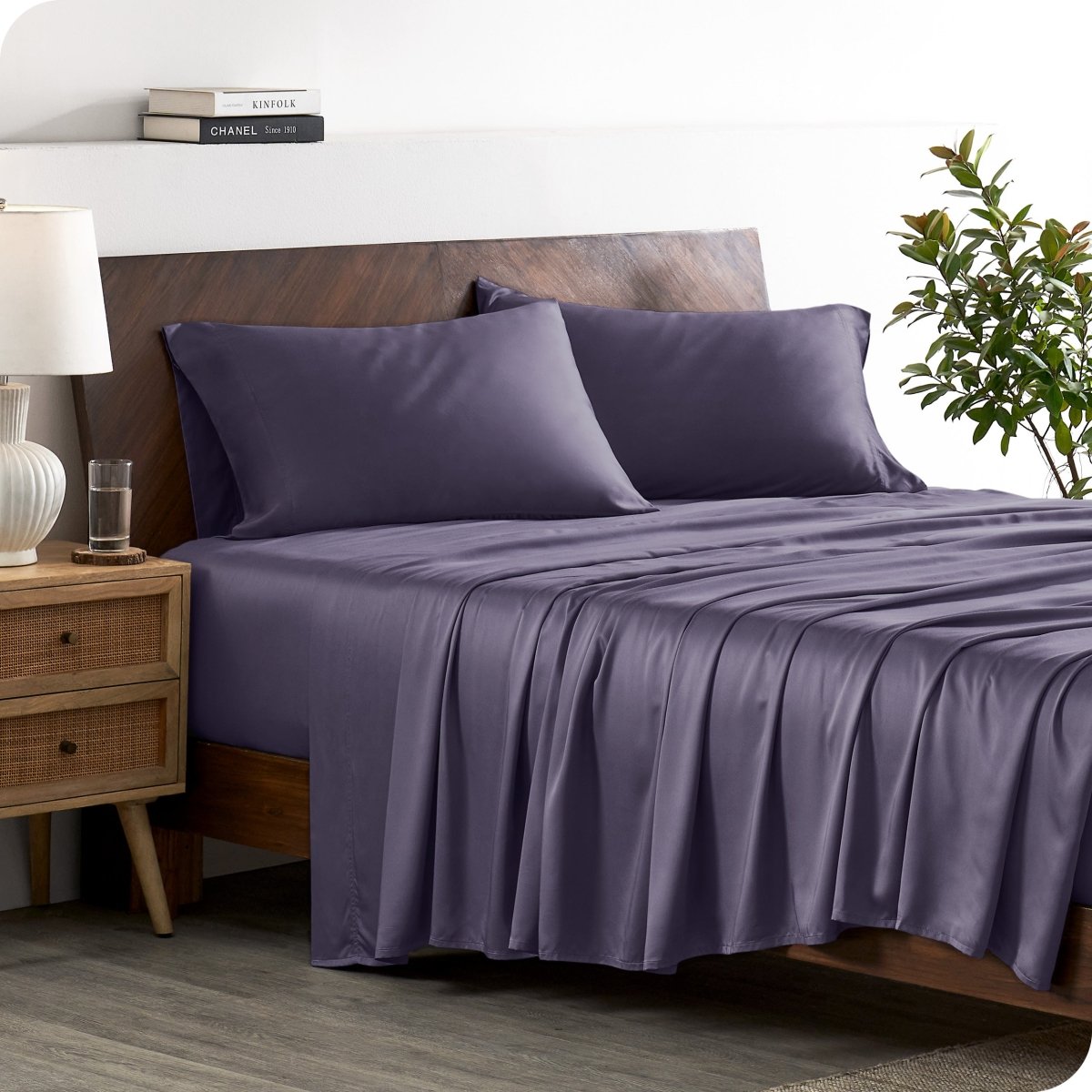 A stylish bed with bamboo sheets and pillowcases, showcasing a sophisticated and elegant bedroom setting.