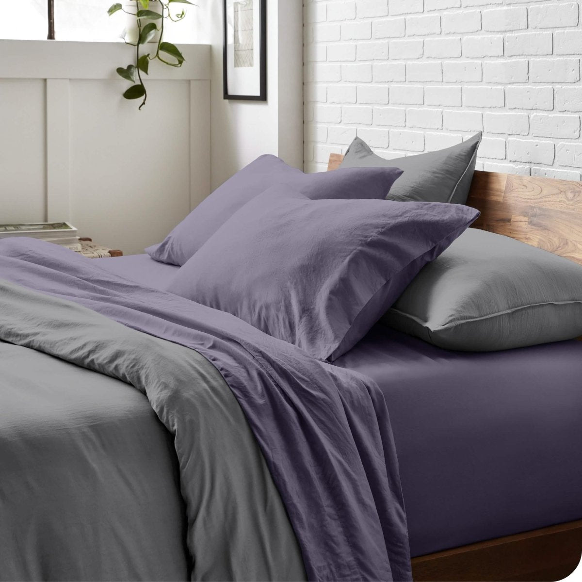 Modern bedroom with washed sheets and duvet cover on a bed
