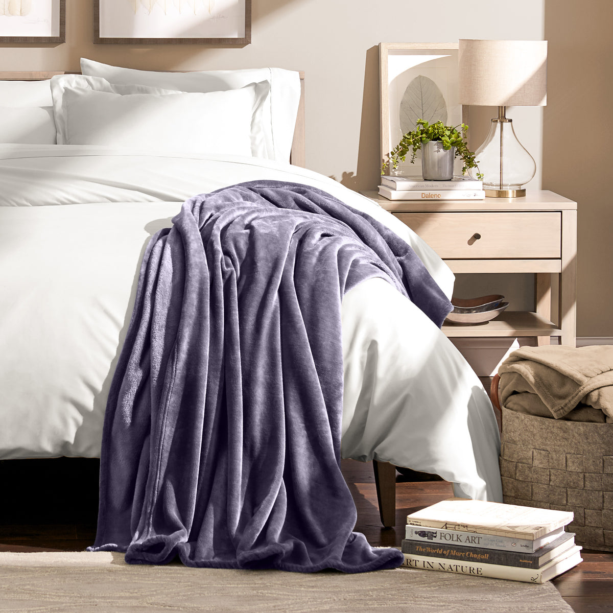 Microplush blanket draped over the corner of a bed