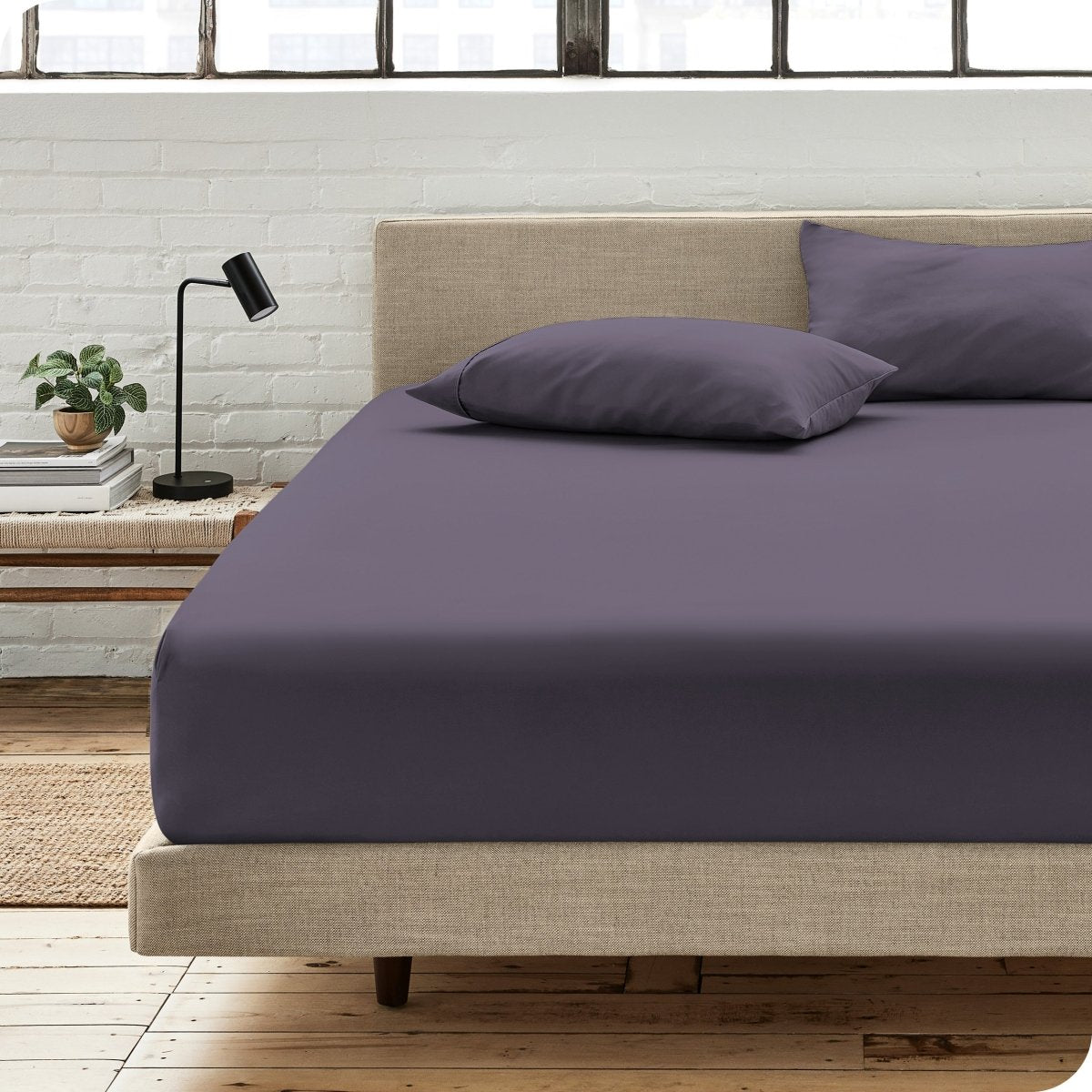 Bedroom scene with organic cotton fitted sheet and pillowcases on a bed