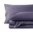 A sateen sheet set folded and stacked on a white background.