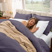 Woman sleeping in a bed with percale bedding