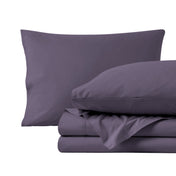 Percale sheets folded and matching pillowcases with pillows in them