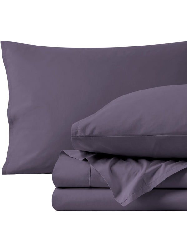 Percale sheets folded and matching pillowcases with pillows in them