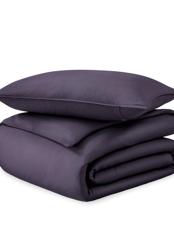 A sateen duvet set arranged in a stack