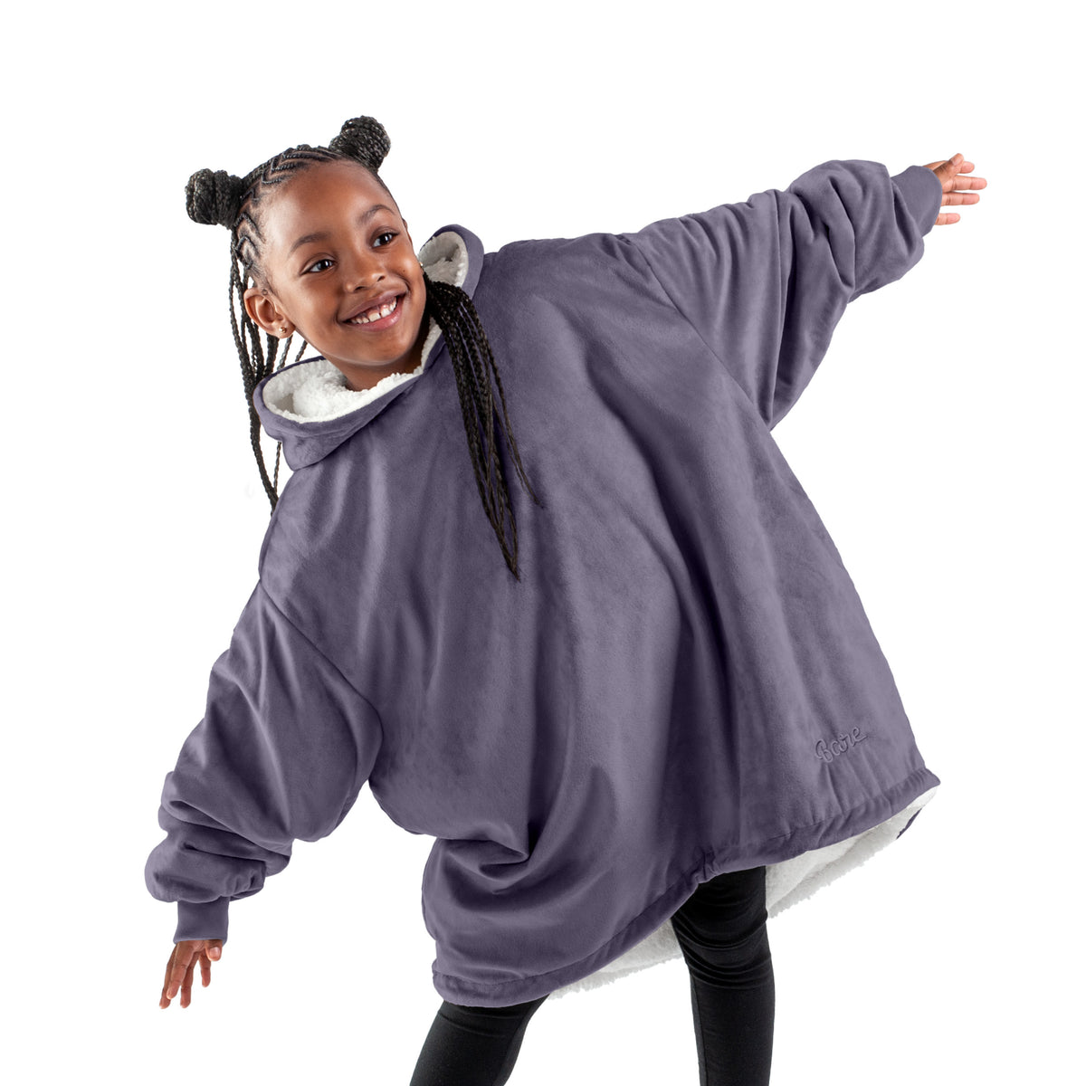 A child with a sherpa wearable blanket on