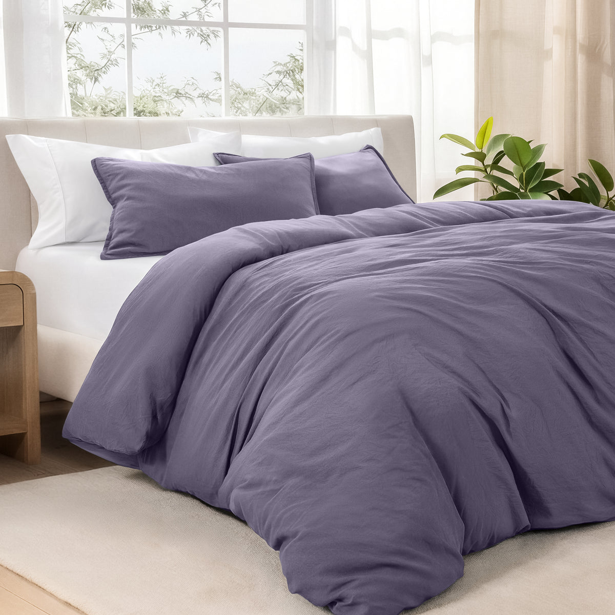 Bedding set on a bed in a bright room with natural light