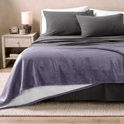 Blanket draped over a chair in a cozy living room setting.