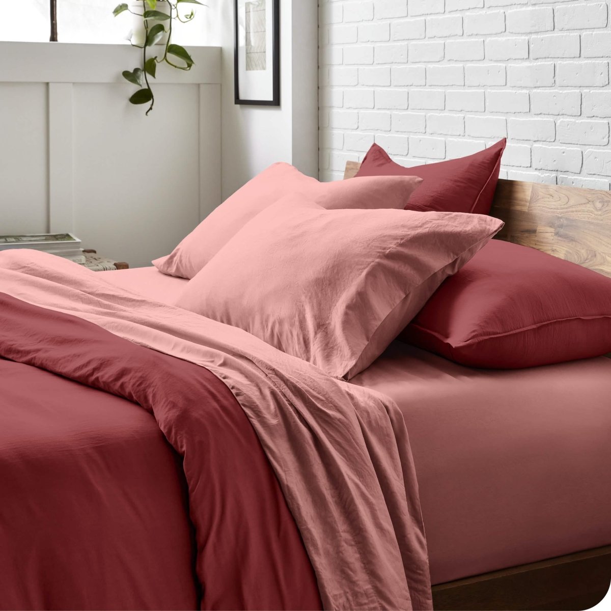 Modern bedroom with washed sheets and duvet cover on a bed