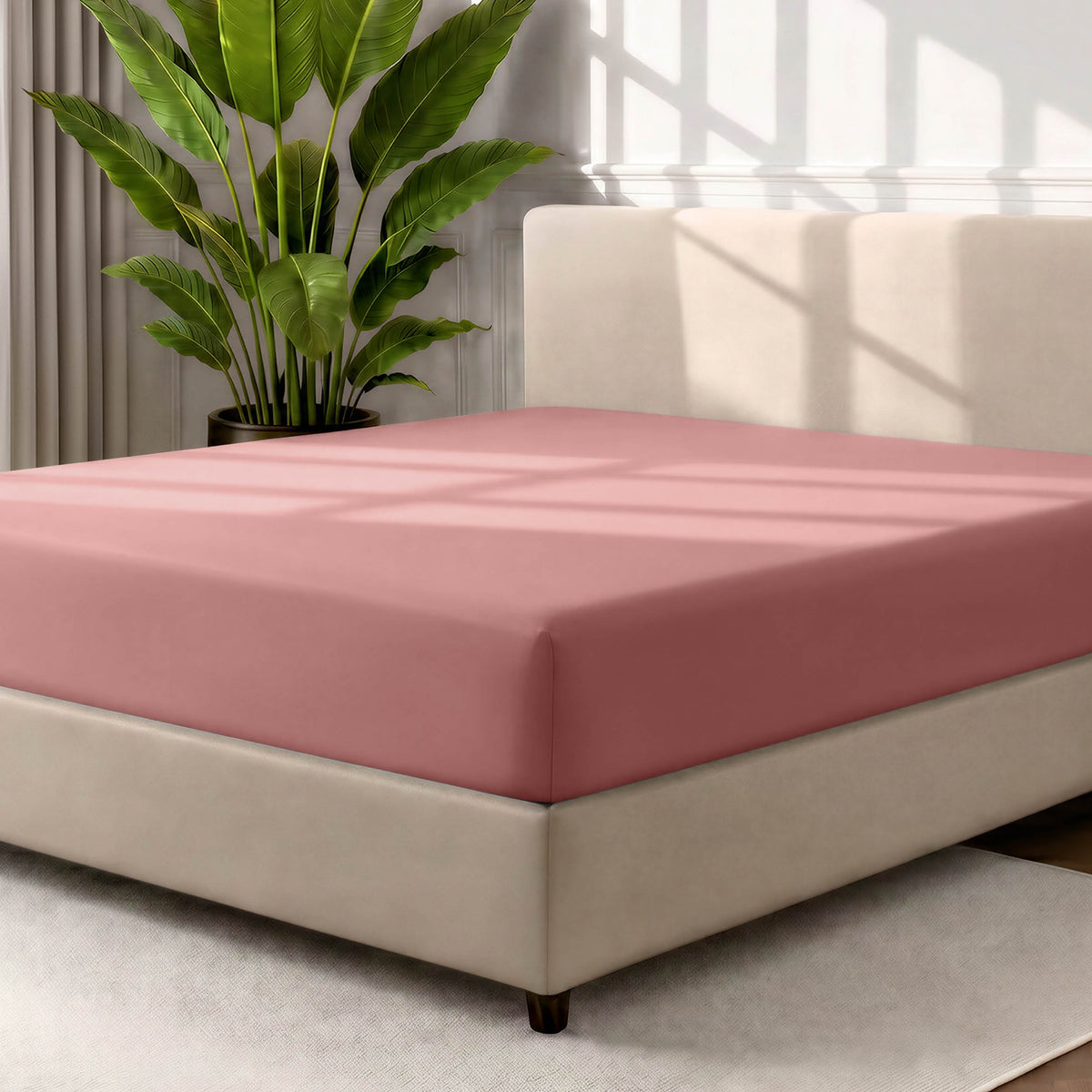 Ultra soft fitted sheet on a mattress with the sun shining into the bedroom