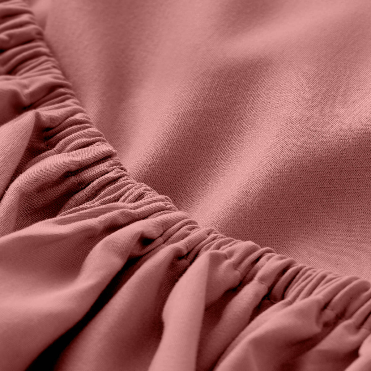 Close-up of fitted sheet with all around elastic
