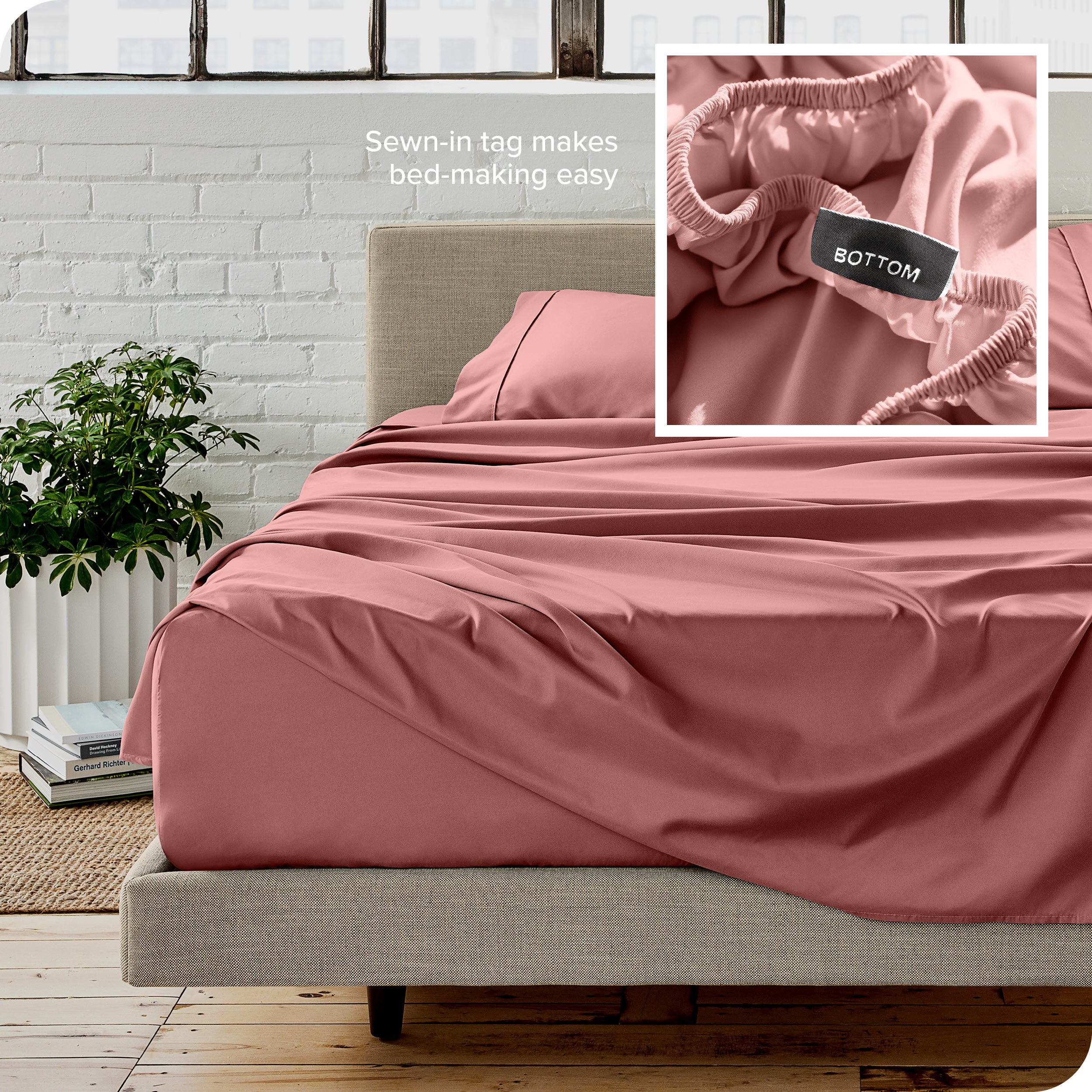 Close up of sewn in tag and matching sheets on a bed