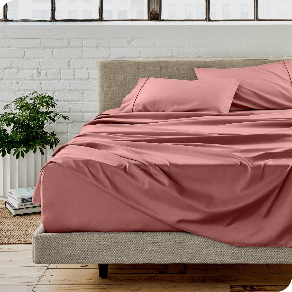 A modern bedroom with microfiber sheets on the mattress
