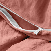 Close-up of a duvet cover with a zipper, featuring the brand Bare Home