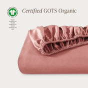 Certified GOTS Organic fitted sheet on a light gray background