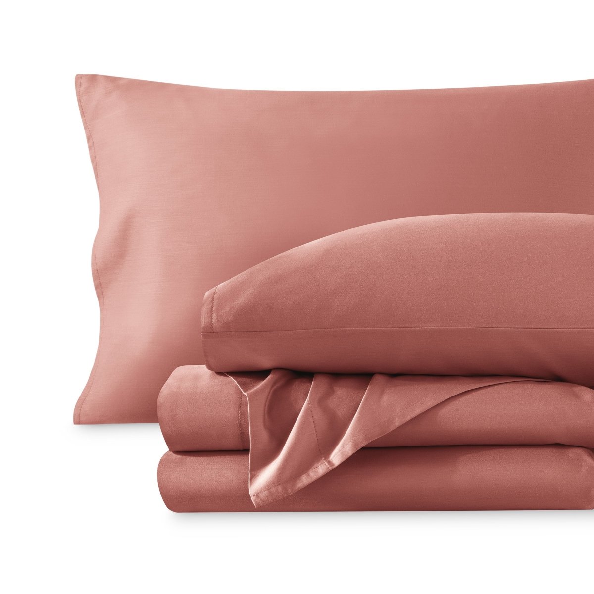 A sateen sheet set folded and stacked on a white background.