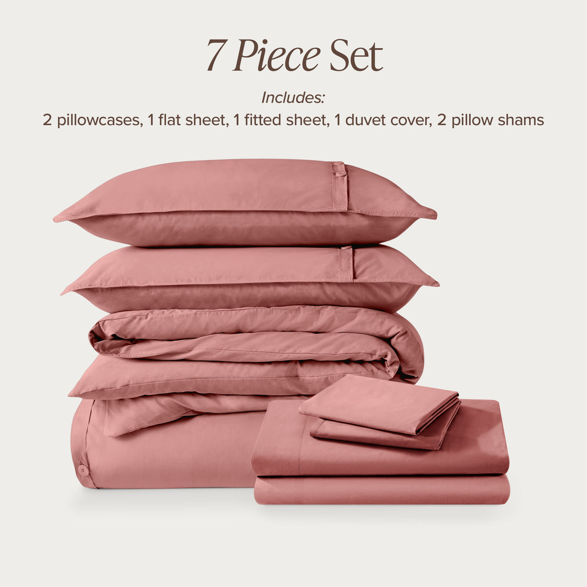7-piece percale bedding set with pillowcases, flat sheet, fitted sheet, duvet cover, and pillow shams on a light background.