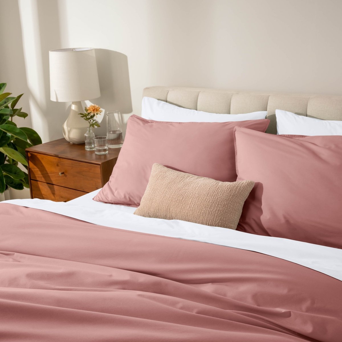 Bed with percale bedding in a bedroom setting